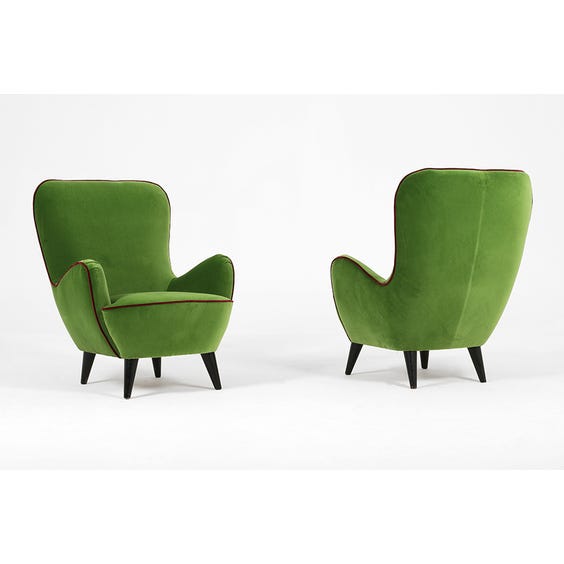 image of Emerald green velvet curved armchair