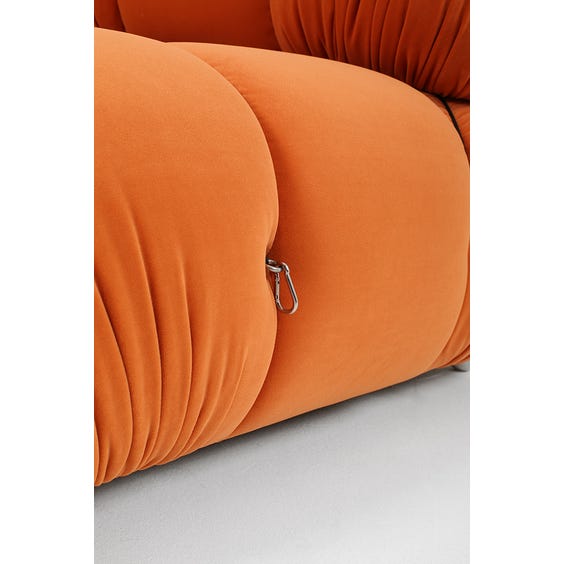 1970s padded pumpkin orange armchair image
