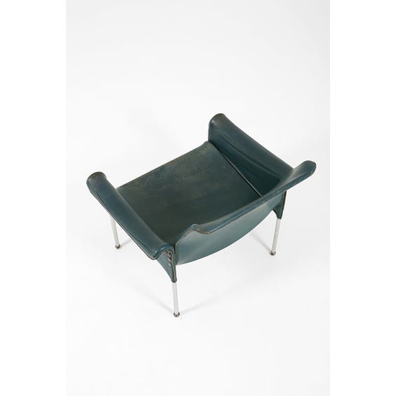 image of 1960's worn teal leather armchair