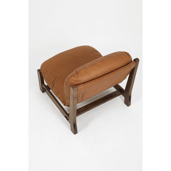 image of 1970's low soft tan brown leather lounge armchair
