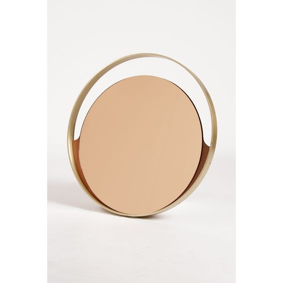 image of 1970s circular peach tinted mirror