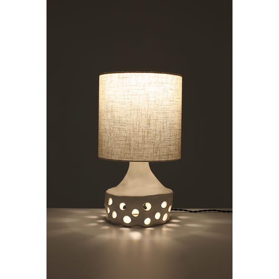 image of Handmade white cubby disc shaped ceramic table lamp